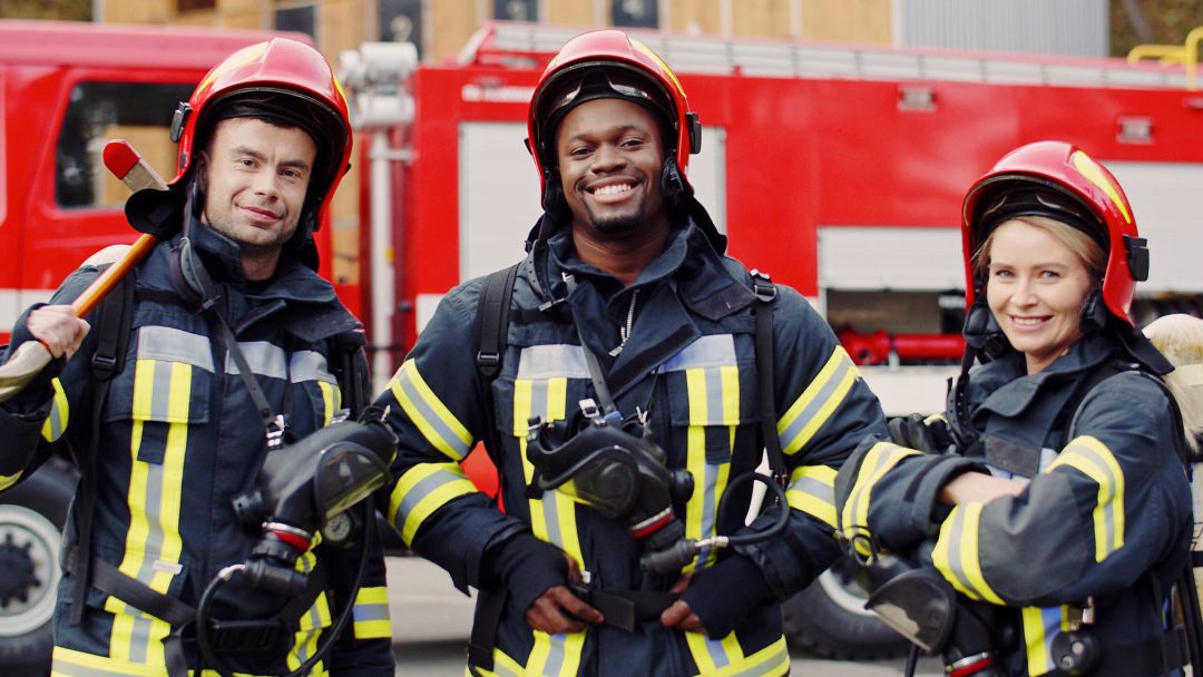 Firefighters wear protective suits with oxygen masks and helmets after fire fighting operation.